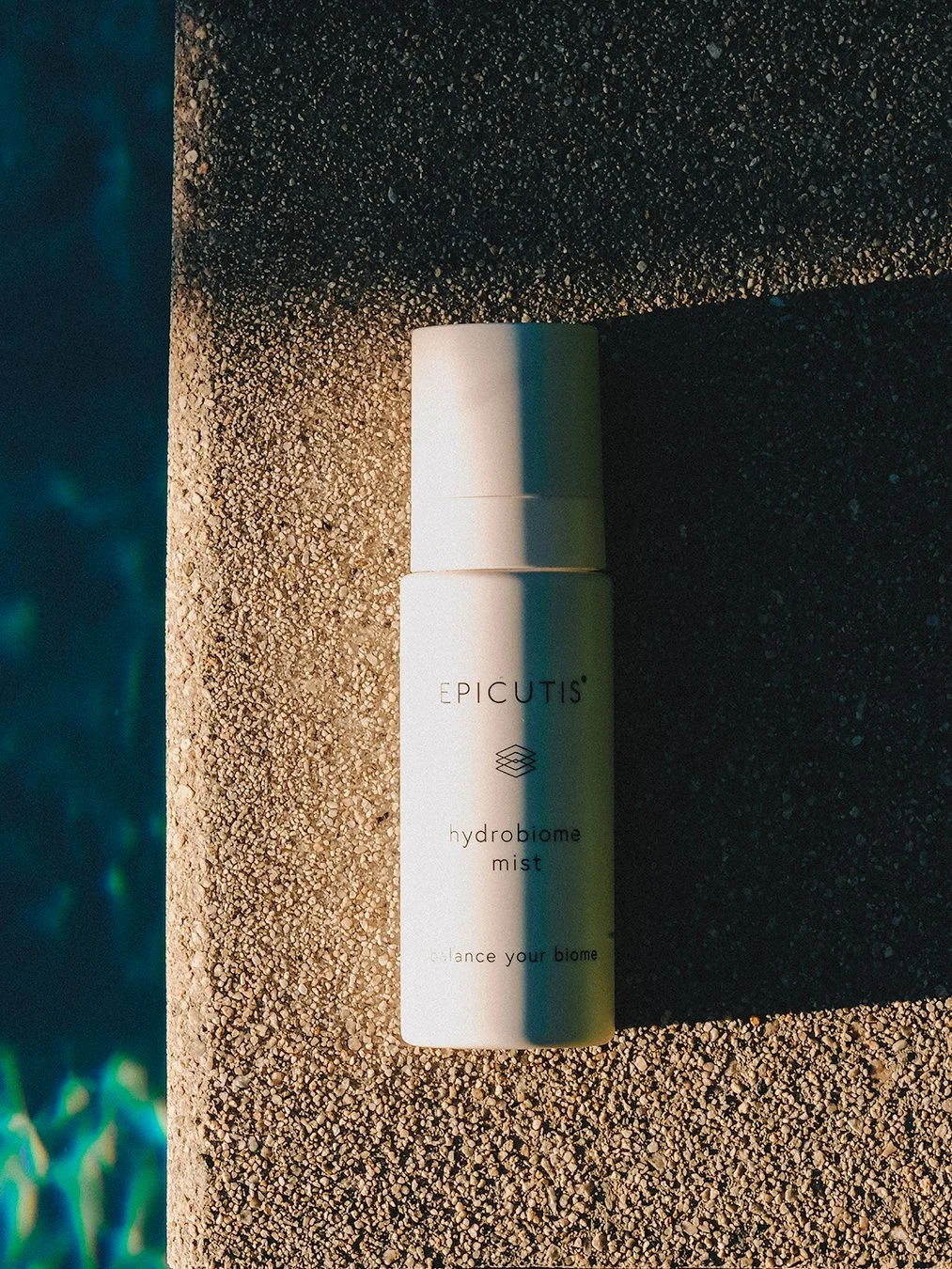 1013X1350 FLAYLAY HYDROBIOME MIST NEXT TO POOL.jpg