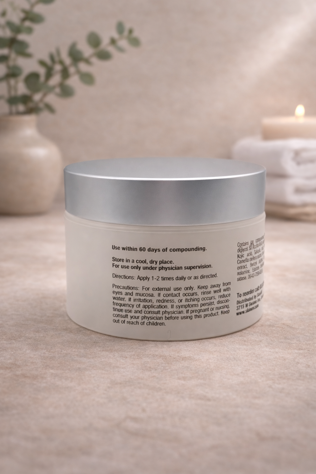 Skincare jar in serene spa setting.png