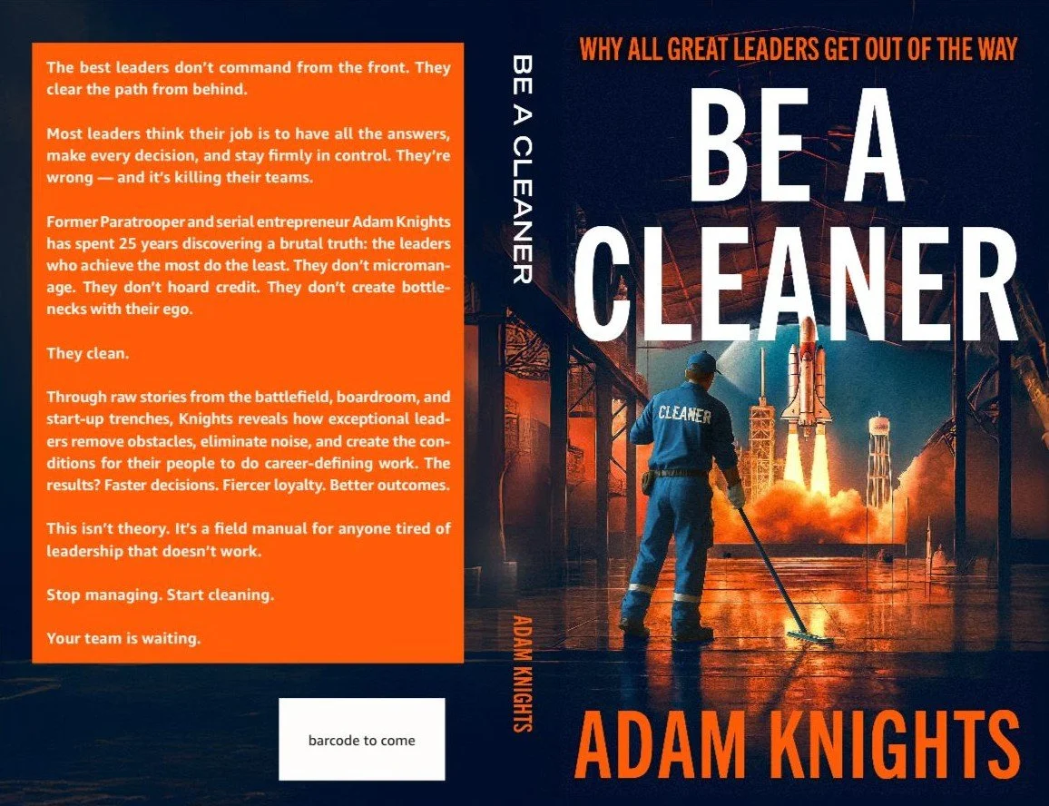 The book cover titled 'Be a Cleaner' by Adam Knights. features a man in a blue uniform labeled 'Cleaner' sweeping a futuristic industrial setting with rockets and launch pads in the background. The subtitle reads 'Why all great leaders get out of the way.' The back cover has an orange background with white text discussing leadership and cleaning.