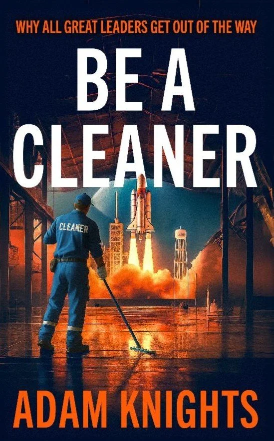 Book cover titled "Be a Cleaner" by Adam Knights, with a person in a blue cleaning uniform and cap labeled "Cleaner" holding a floor cleaning machine, with a rocket launching in the background under a dark sky.