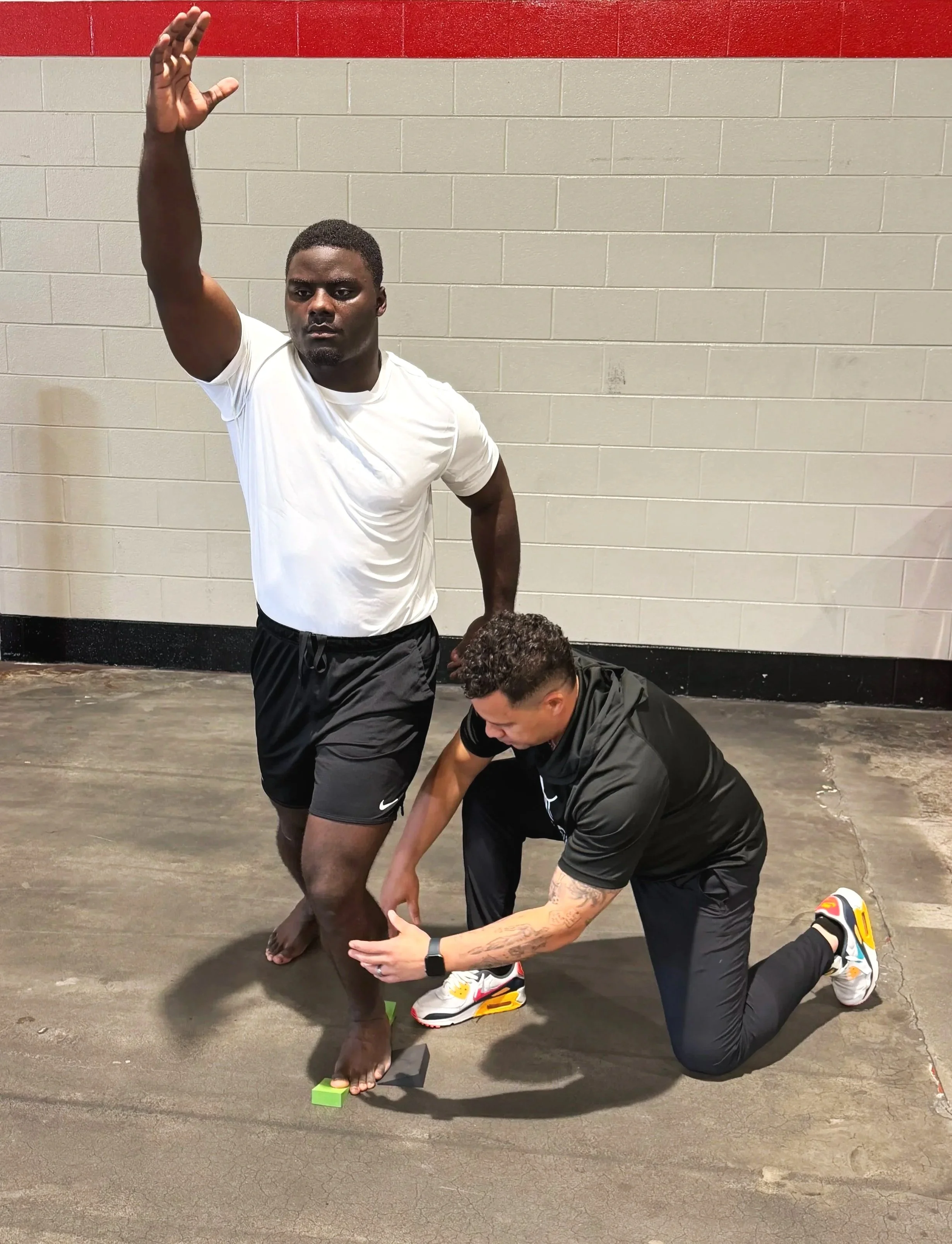 Ale Oliveira of Aptare Lab in Indian Land, SC, working with an ahtlete to perfect performance.