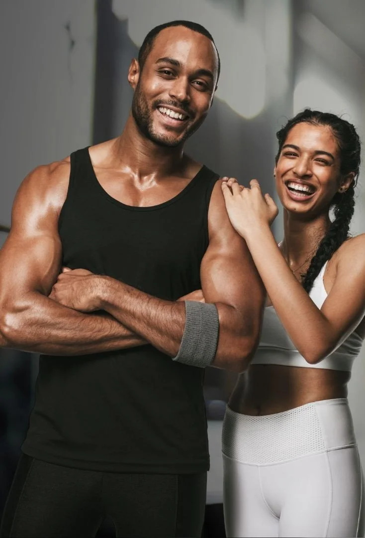 Young couple participating in functional training workout together at Aptare Lab focused on fitness, strength, and shared performance goals.