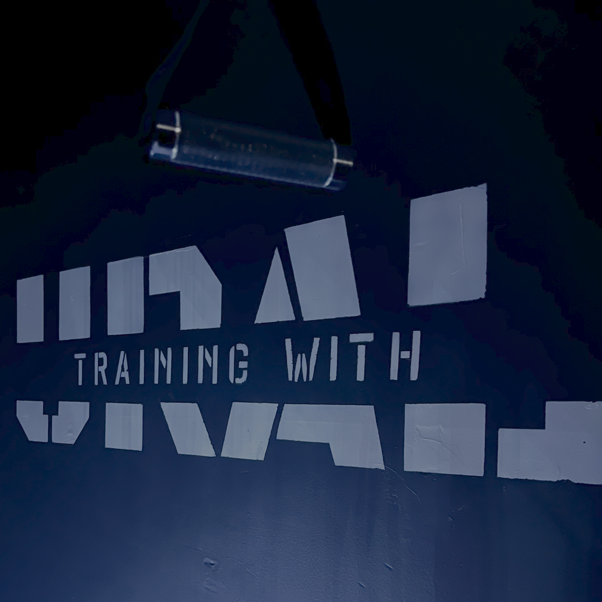 'TRAINING WITH URAL'  sign or artwork.