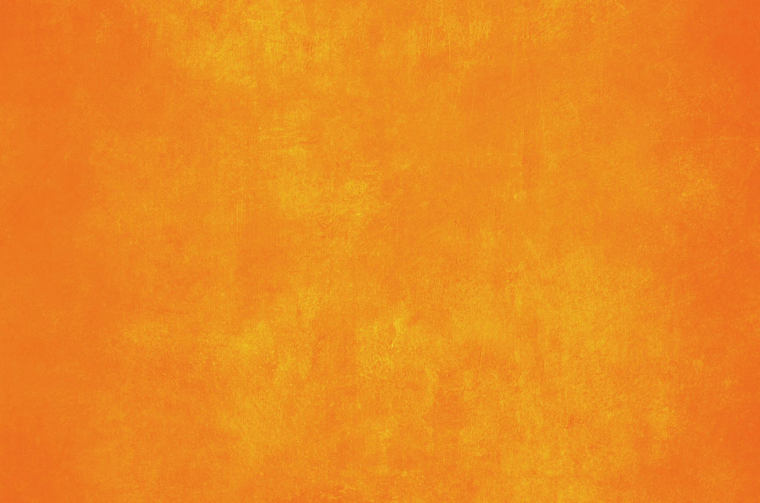 Close-up of a textured, bright orange surface.
