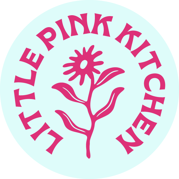 Litter Pink Kitchen logo with a pink flower in the center and pink text circling around it on a light blue background.