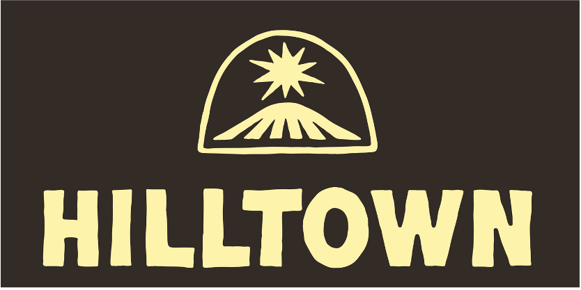 Logo with a stylized mountain, star above, and the word 'HILLTOWN' in bold letters.