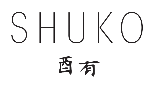 Shuko logo with stylized text and symbol, including Japanese characters