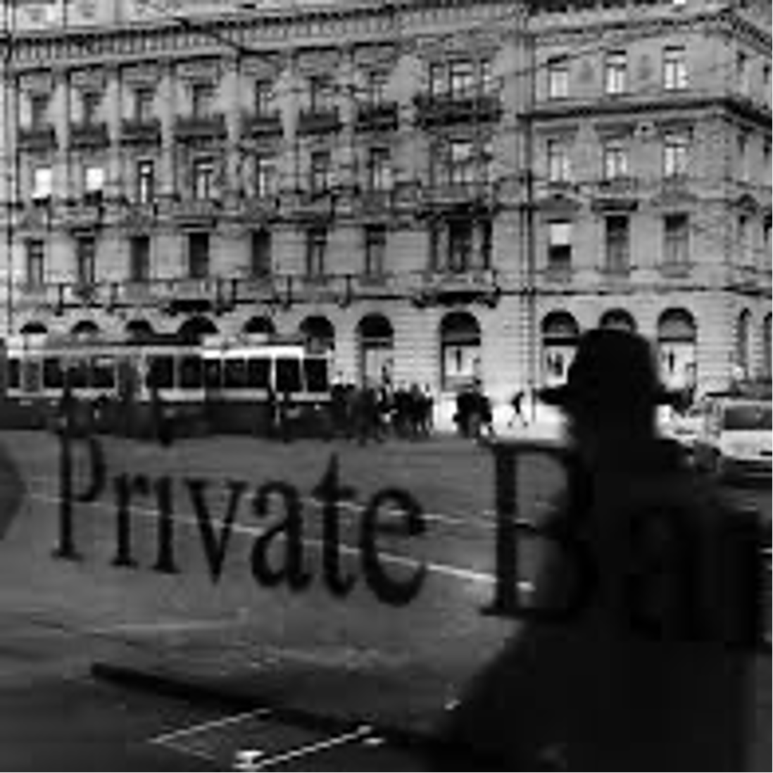 View of a city street with a large building, a trolley bus, and people walking, seen through a window with a 'Private' sign.