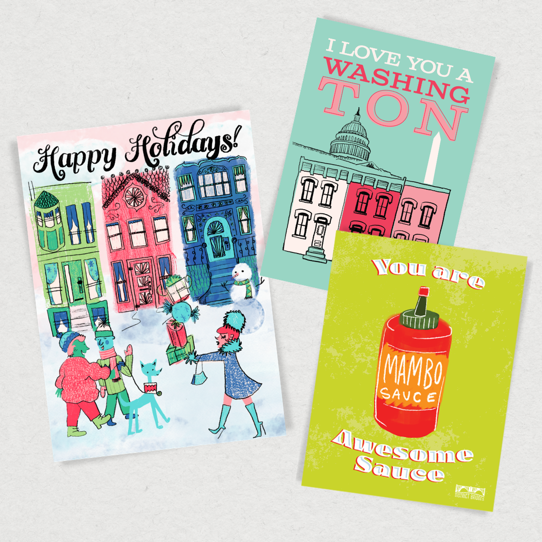 Three colorful illustrated greeting cards with festive messages and drawings. The first card says 'Happy Holidays' and depicts people and buildings in a winter scene. The second card says 'I Love You A Washing Ton' with a drawing of the U.S. Capitol and white house. The third card says 'You are Mambo Sauce Awesome Sauce' with a drawing of a bottle of mambo sauce.