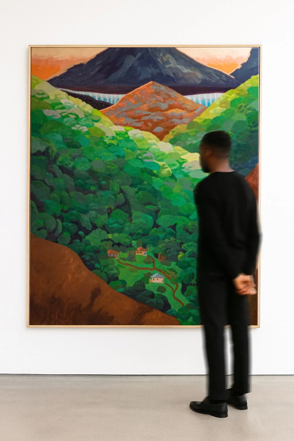 A person viewing a colorful landscape painting of a mountain, bridge, and lush green trees in an art gallery.