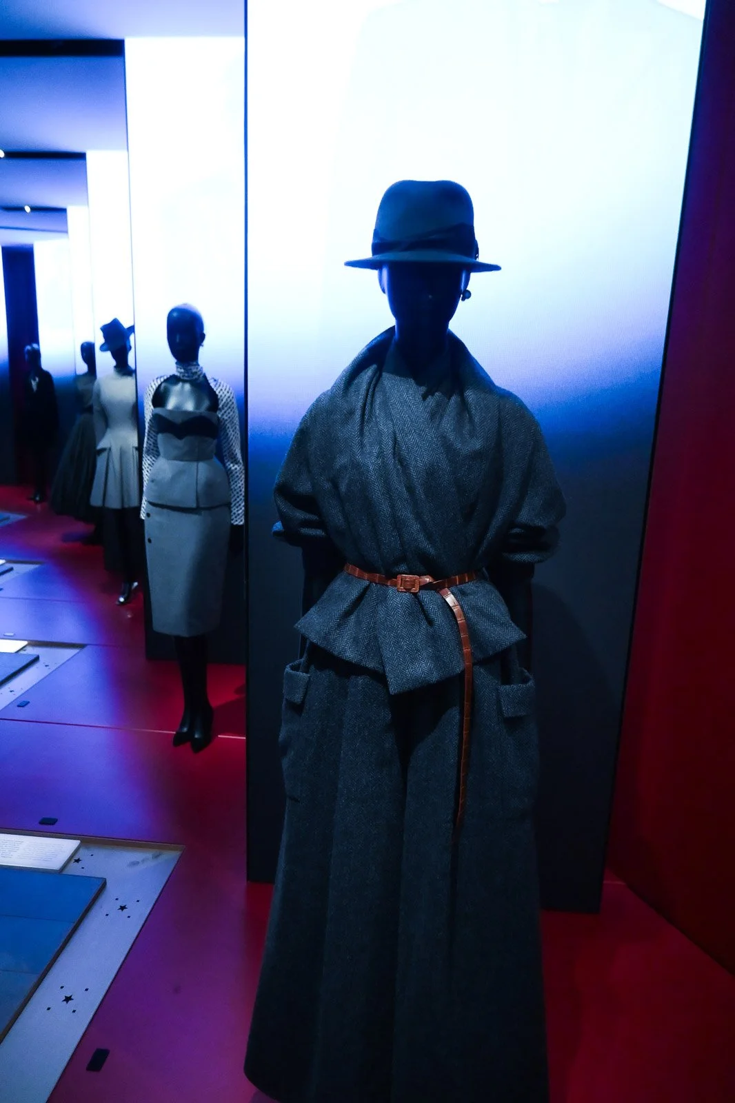 Mannequins displaying classic Christian Dior couture designs at La Galerie Dior museum on Avenue Montaigne in Paris, France.