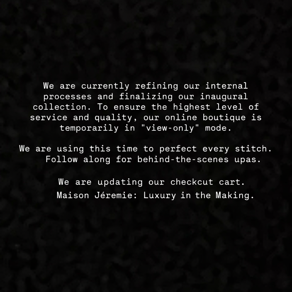 Text message on a dark background explaining that the online boutique is temporarily in 'view-only' mode while they refine processes and perfect stitches, and updating their checkout cart.