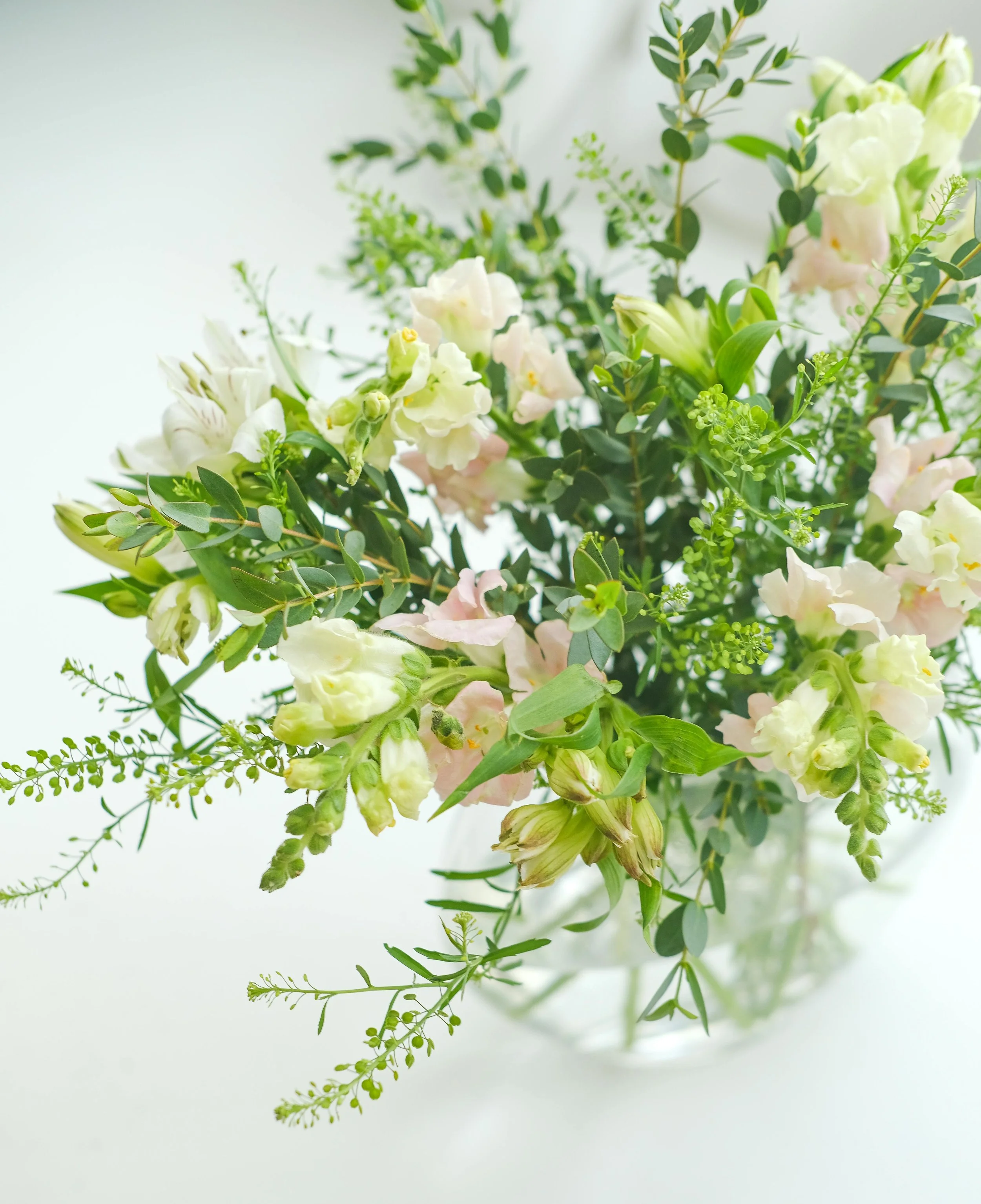 Seasonal vase arrangement designed in a natural style by Poetry in Flowers, Hednesford.