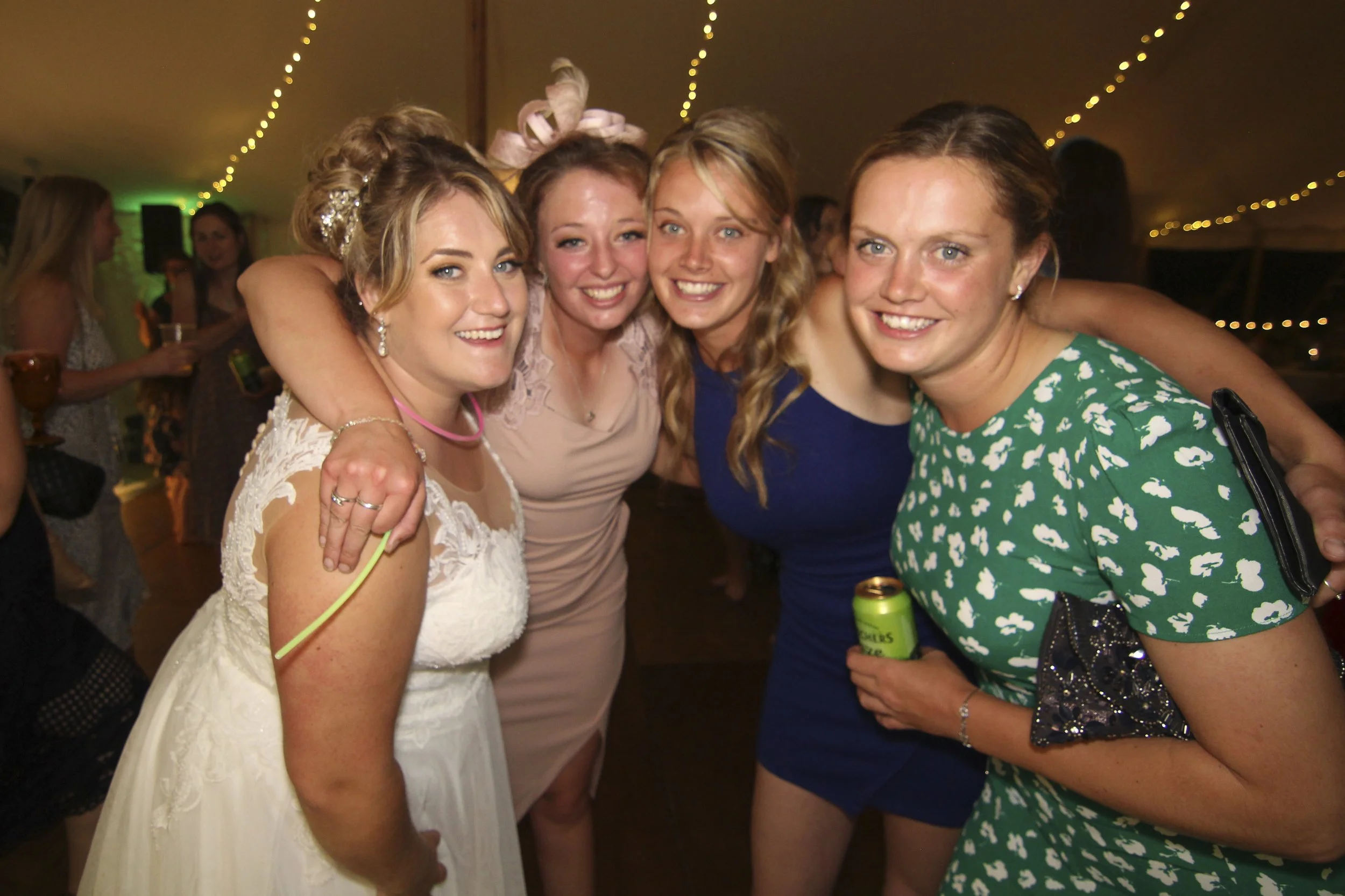 Bride and her friends posing for photopod at farm marquee yfc wedding
