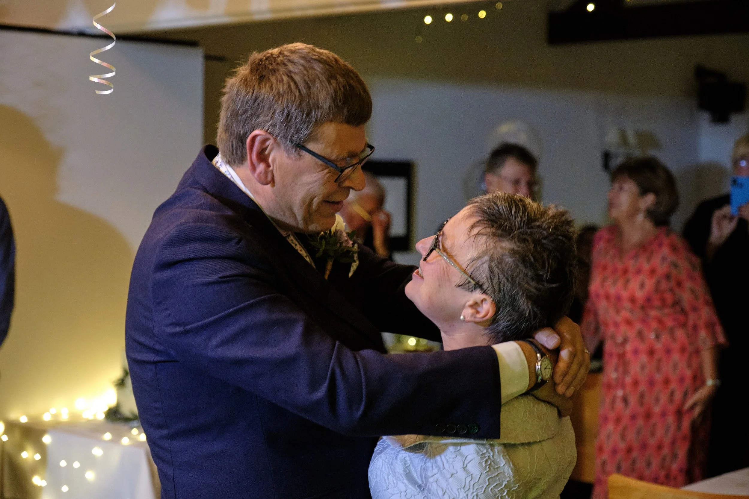 Happy couple in love on the dancefloor at their wedding.