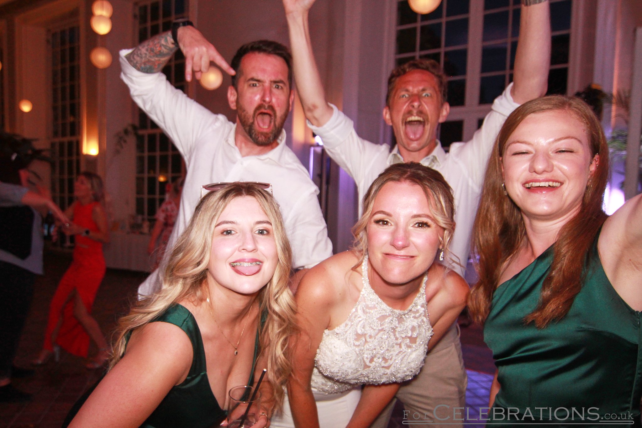 Bride and groom with friends enjoying a PhotoPod picture at The Orangery, Mount Edgcumbe wedding venue.