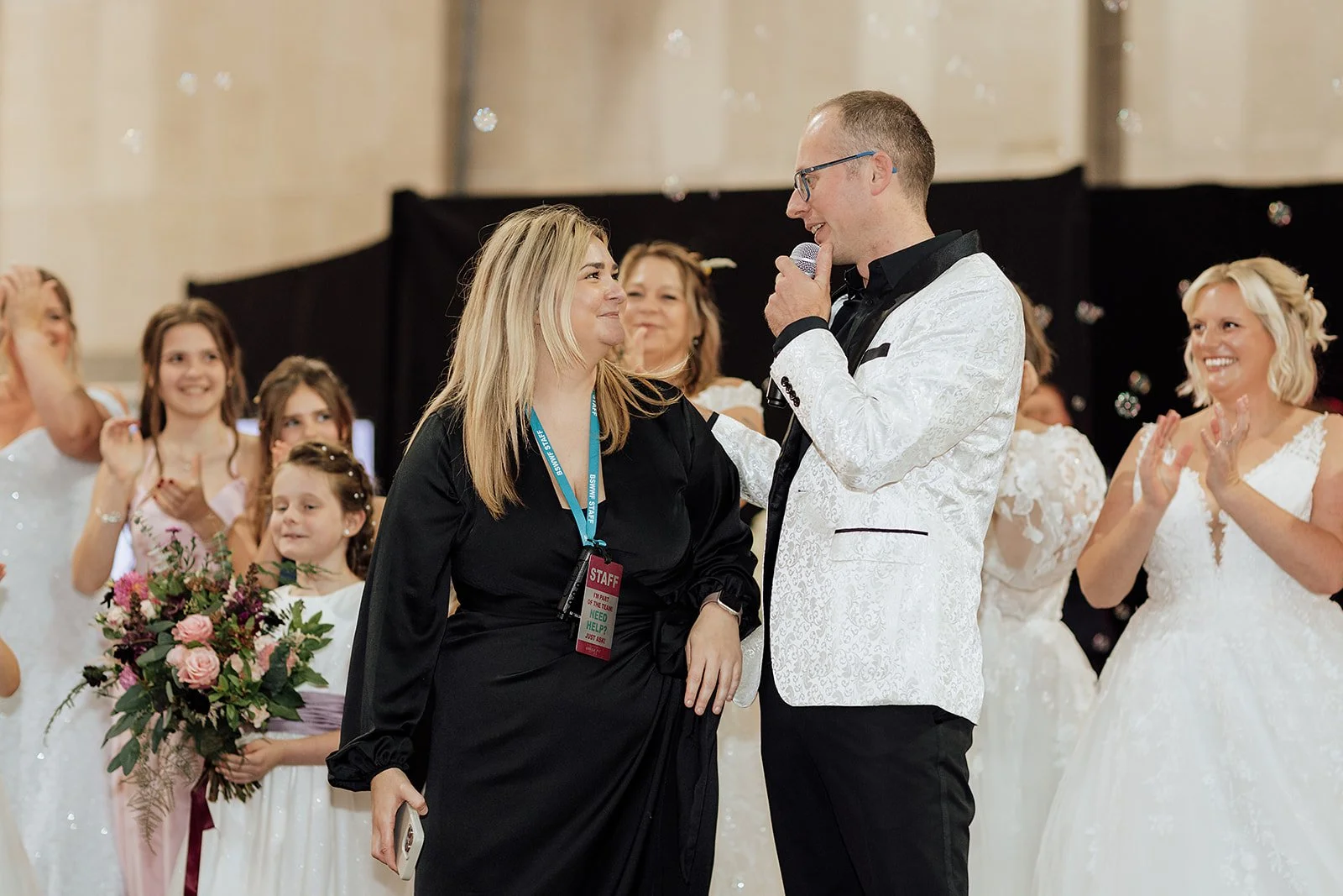 A wedding fair stage and catwalk, where John William Forcelebrations presents prizes and vote of thanks, with bridal models in the background
