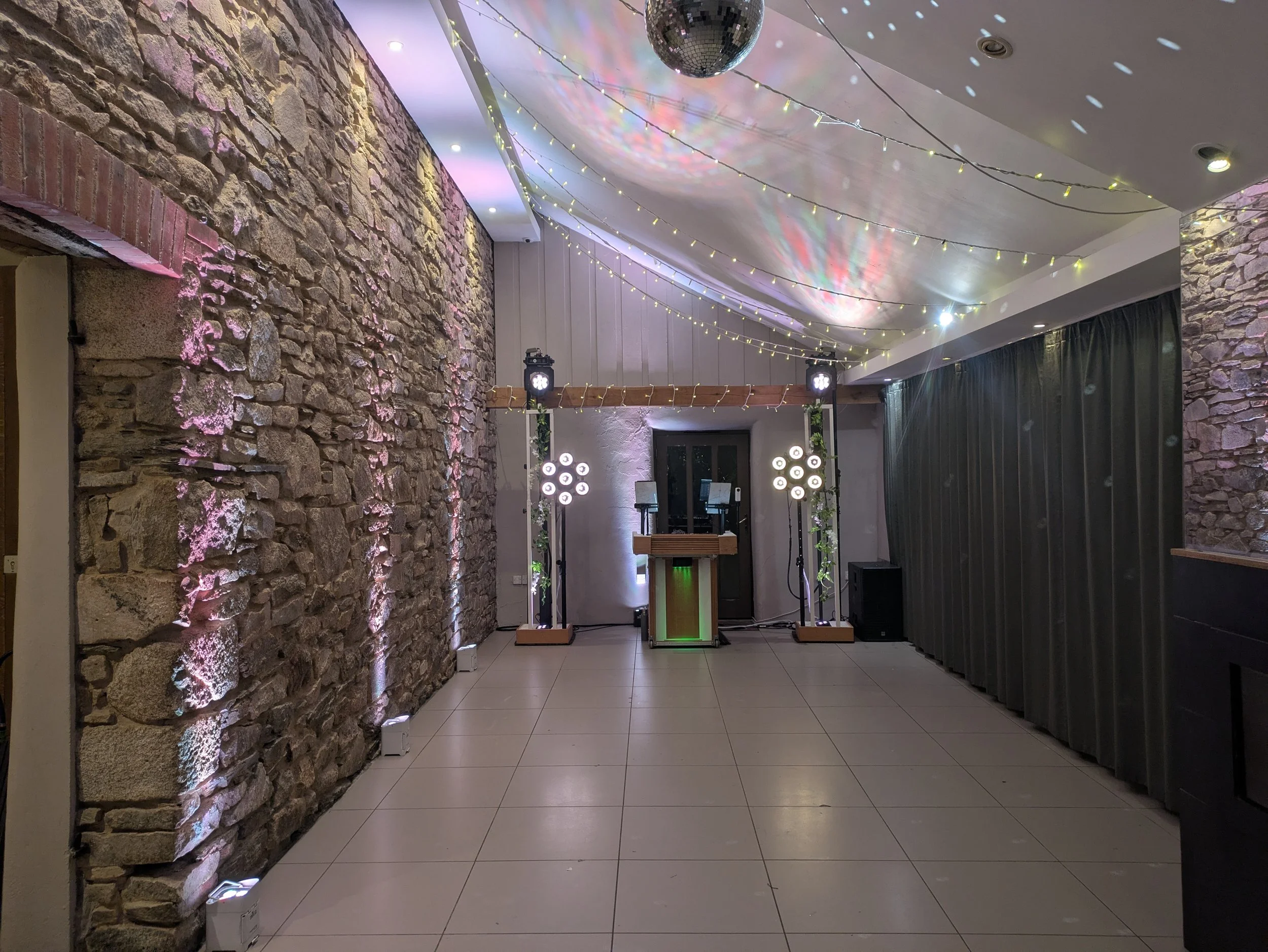 Simple and elegant  wedding disco setup ready for Polly & Sam's guests at Trevenna