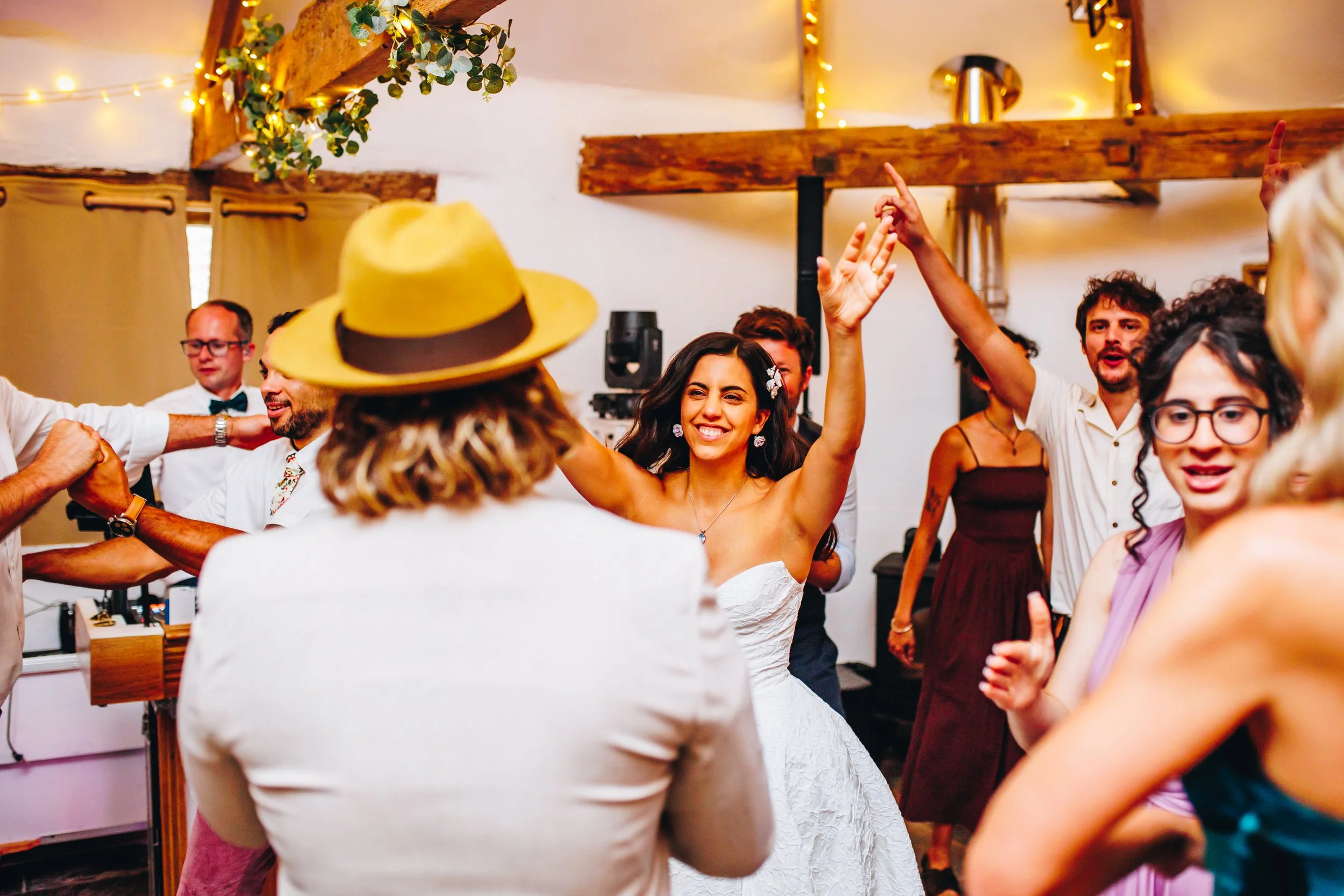 Live saxophonist performing alongside a DJ while guests dance and celebrate