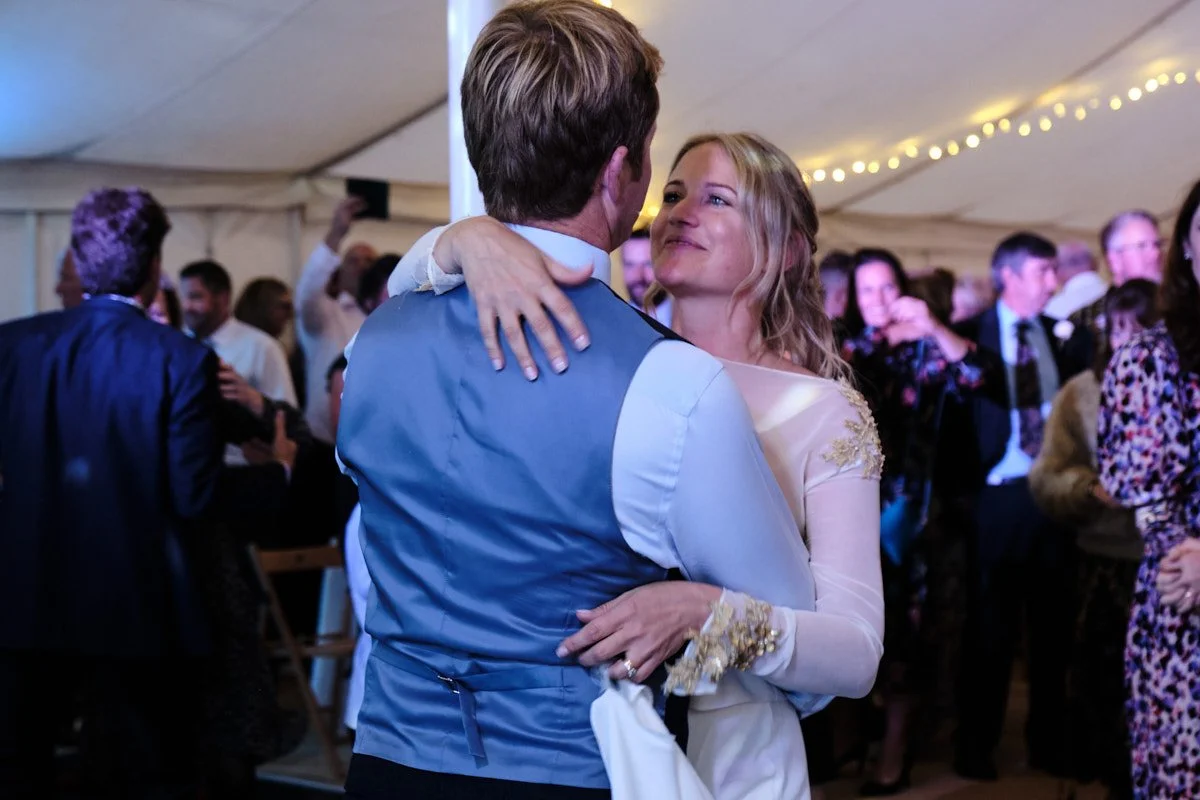 Happy Wedding couple in love on the dancefloor in beautiful marquee