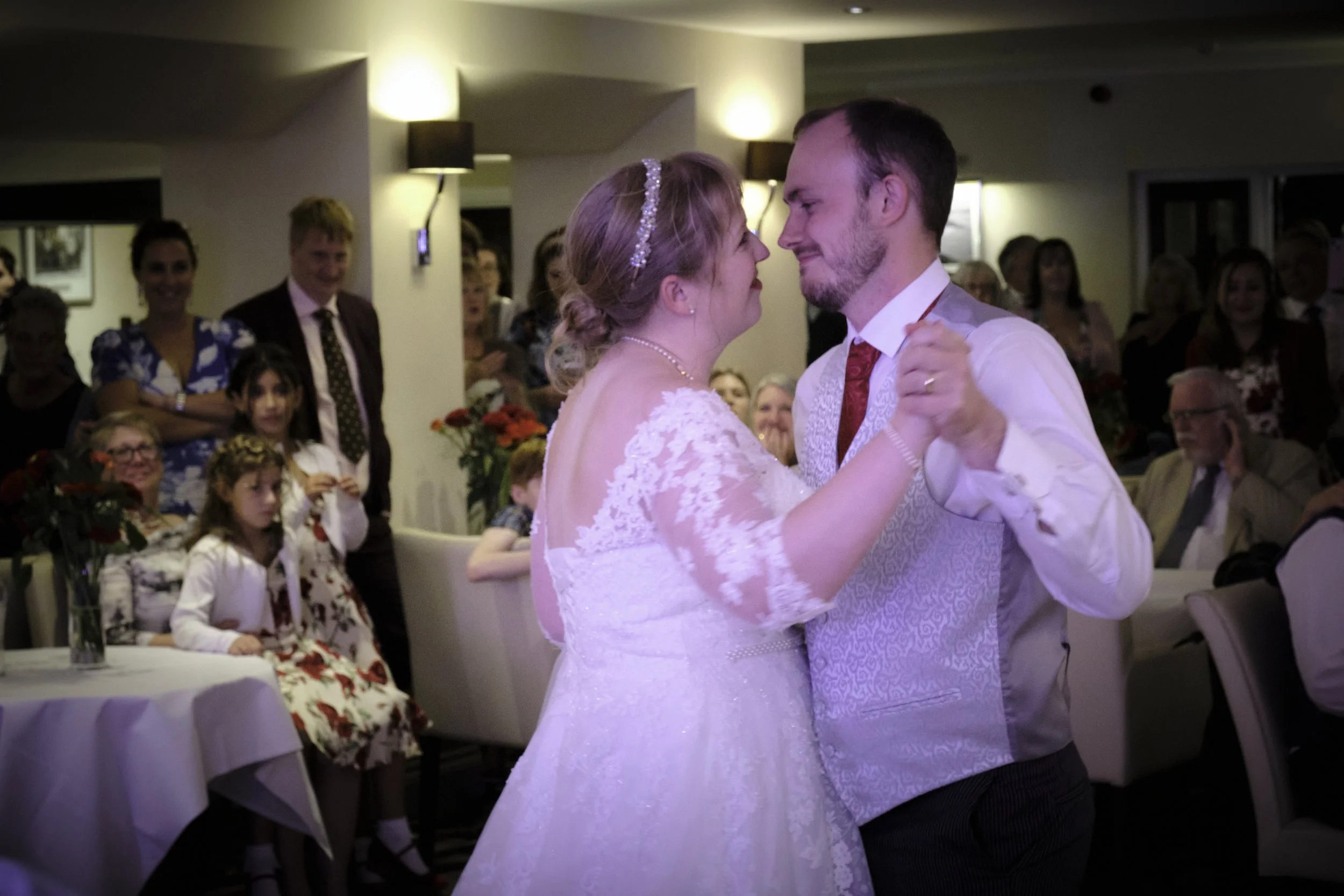 Happy wedding couple sharing a romantic first dance at Carlyon Bay Hotel.