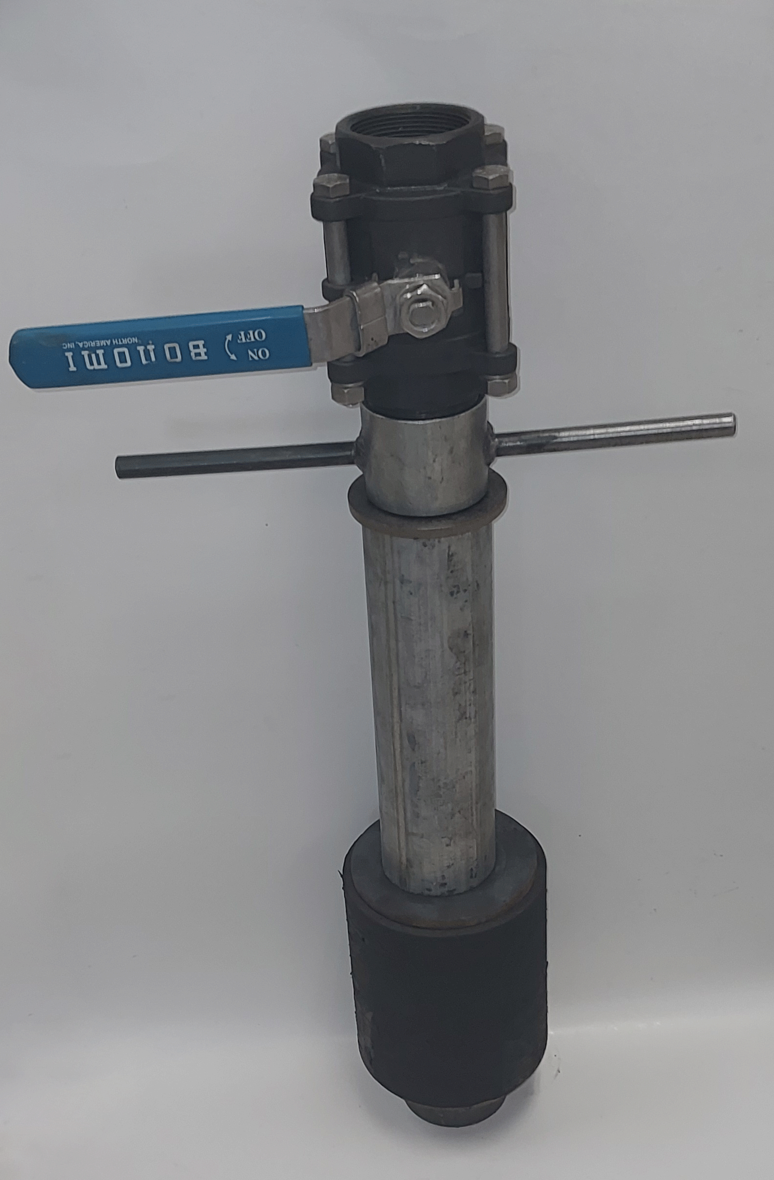 Industrial valve with a blue handle labeled 'OFF' and 'ON', attached to a metal pipe and a black cylindrical base.