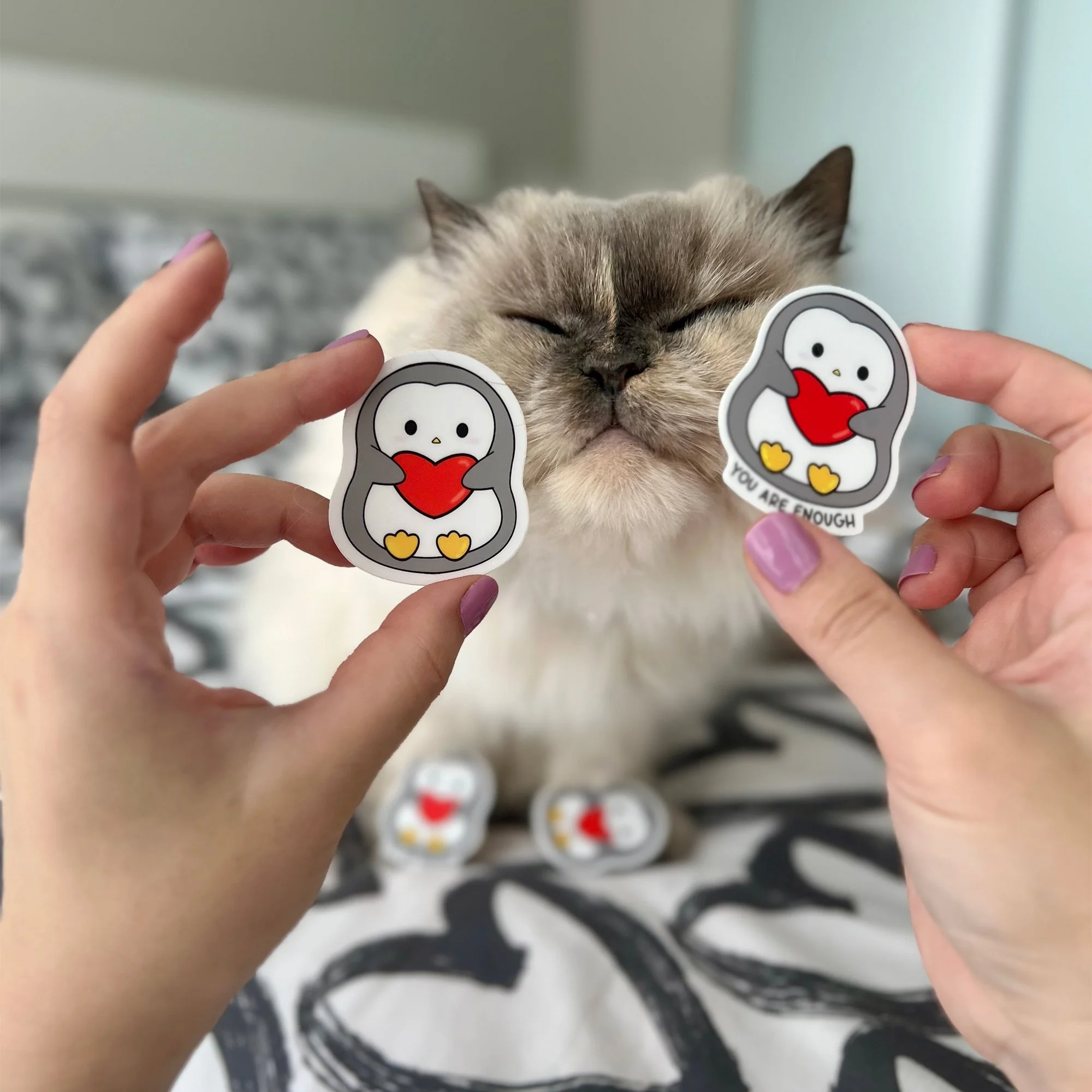 Penguin holding heart sticker