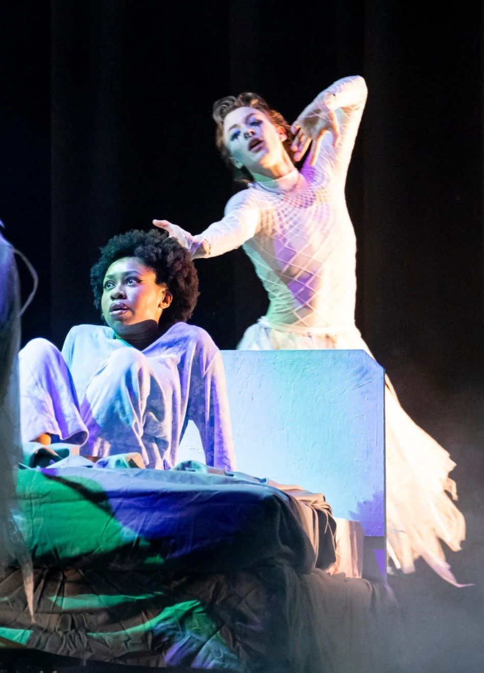 ZEWJ in all white, reaching out like a ghost.