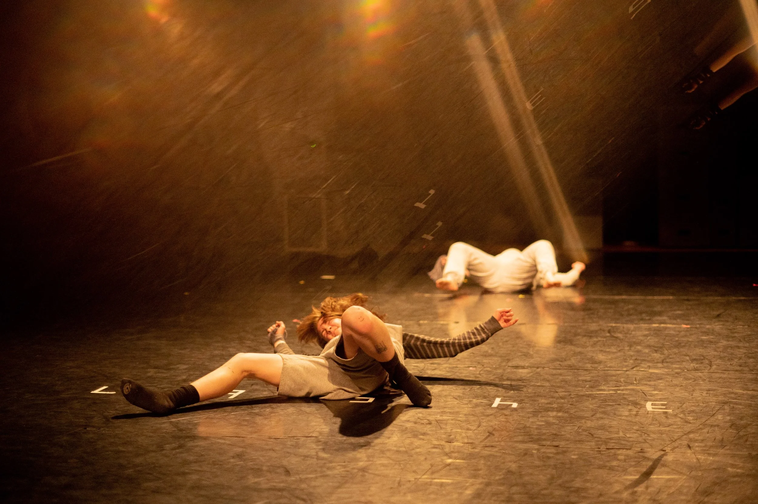 ZEWJ laying on the floor, kicking.