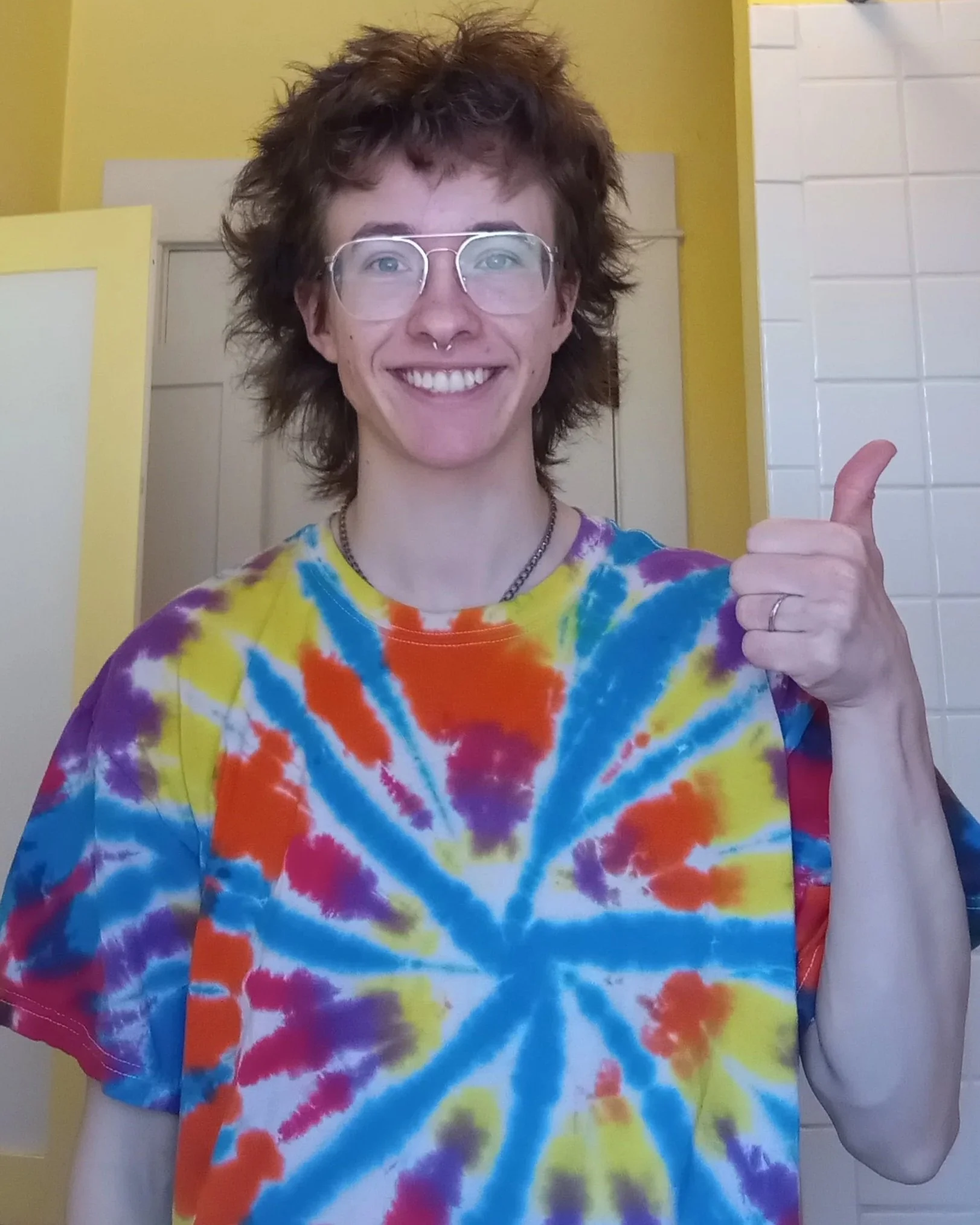 ZEWJ smiling and giving a thumbs up