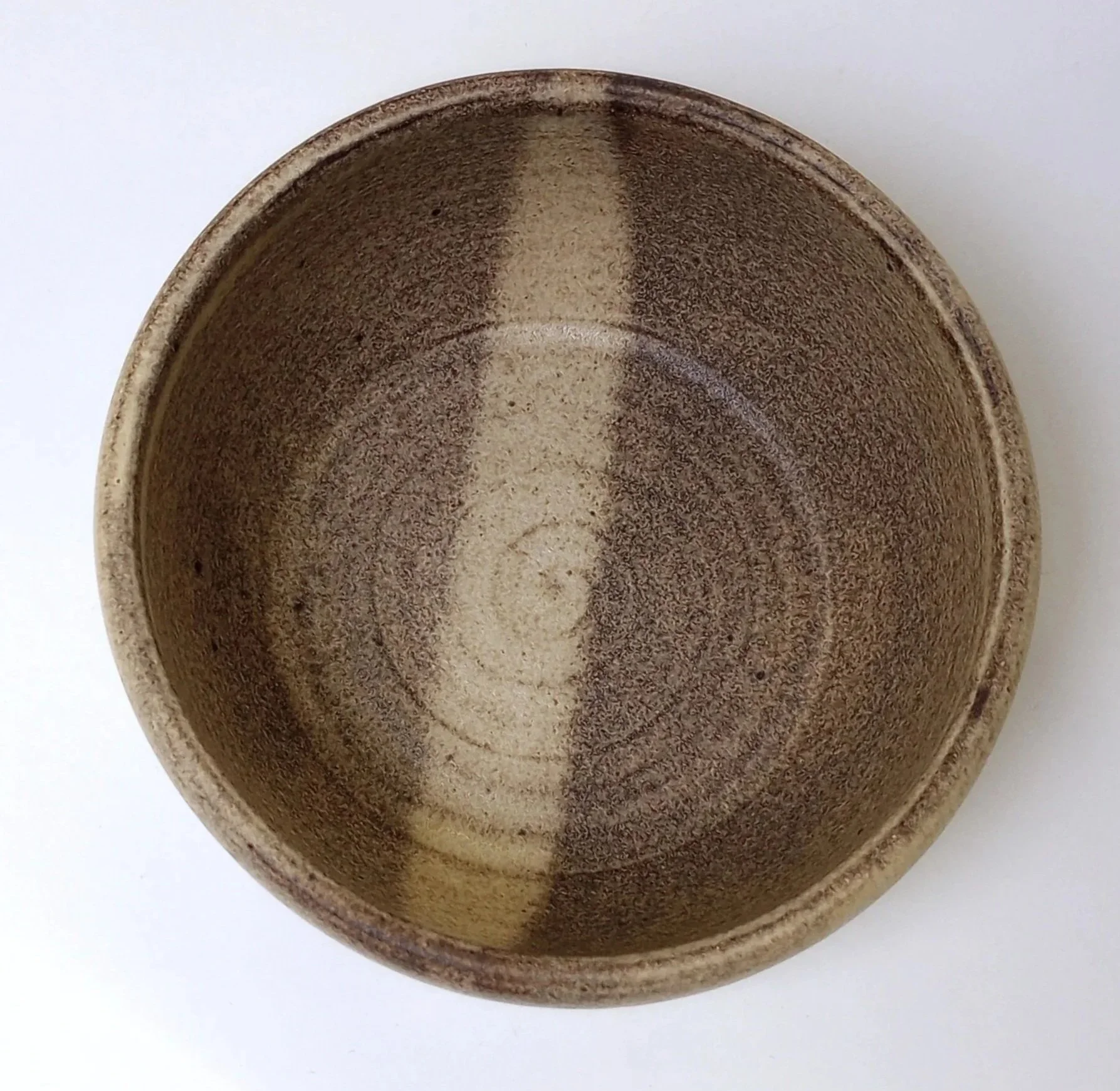 Inside of a bowl with a stripe down the middle