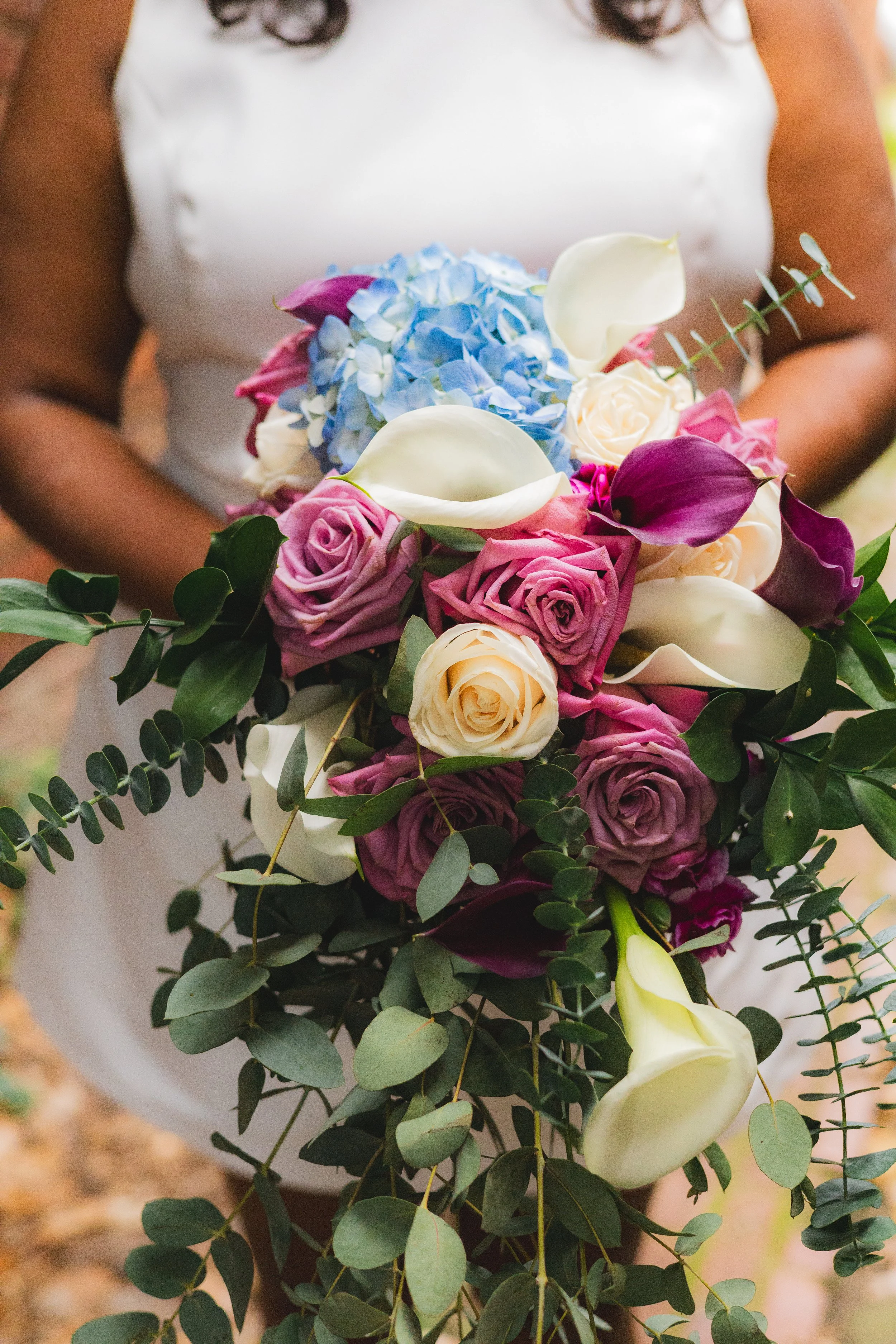 Beautiful Wedding Bouquet of White and Purple Roses, Lillies, and Hydrangeas