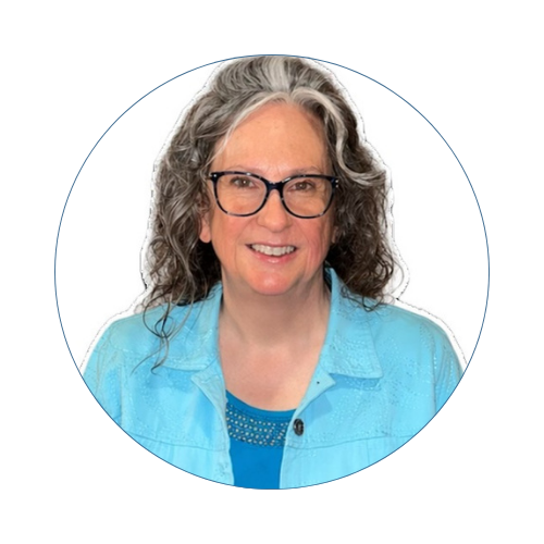 A woman with dark hair in a bun, wearing hoop earrings and a black and white patterned top, smiling against a white background. Lindsay Dernier, Director of Admissions