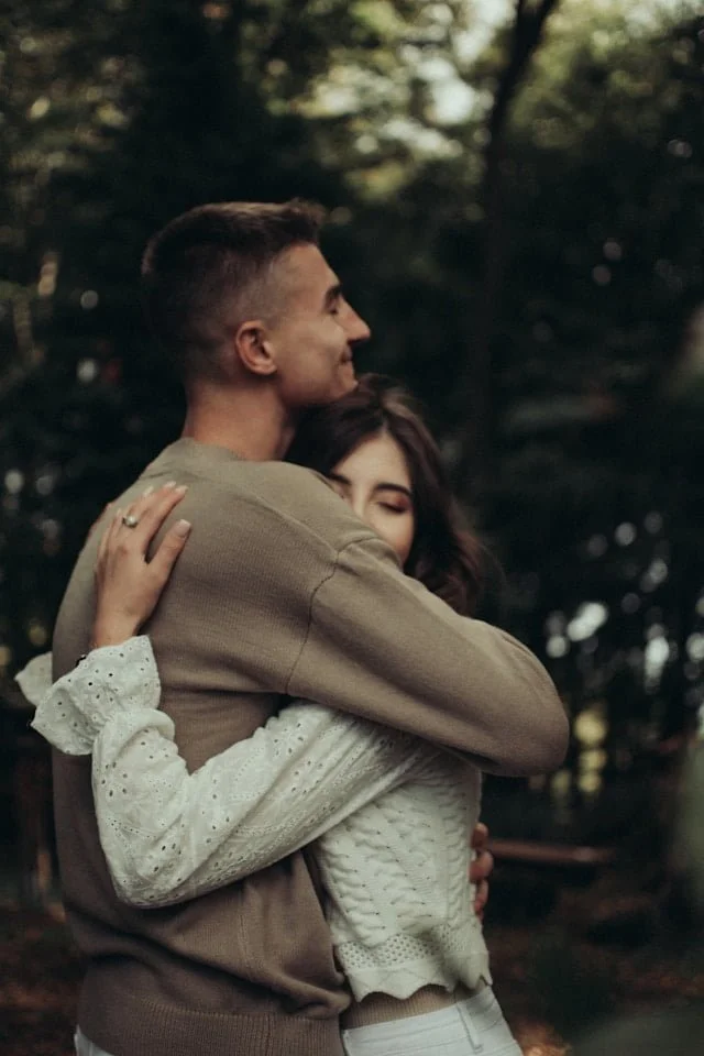 a man and a woman hugging