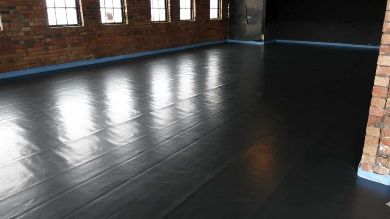 Interior room with perimeter edging and a separating membrane ready for a liquid screed floor in West Midlands.
