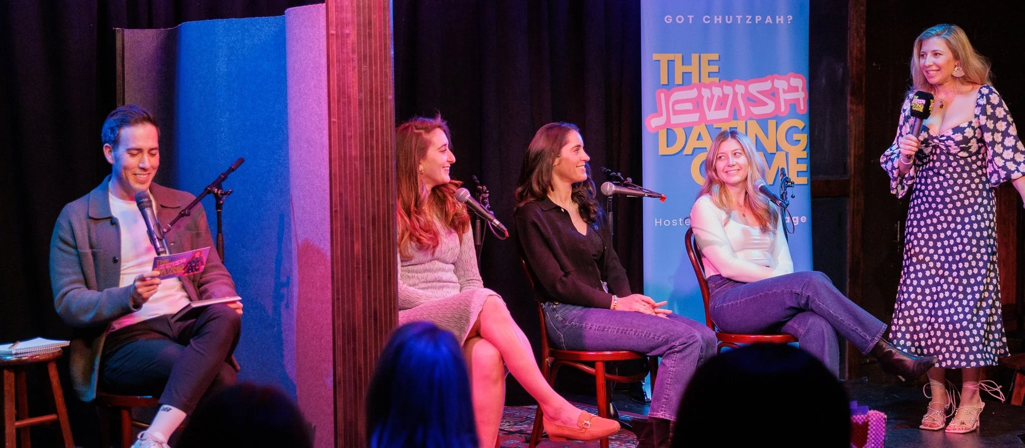 Live audience participation show celebrating Jewish culture, humor, and community onstage at a theater event