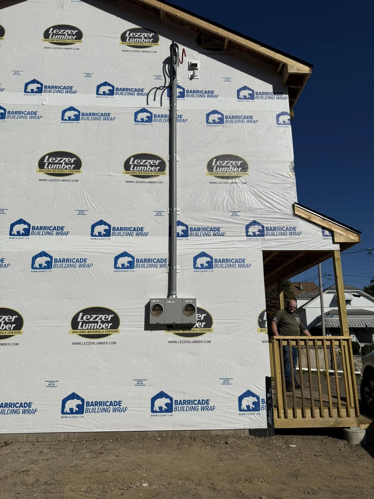 New construction electrical service installation performed by a NEPA electrician, including meter bases and service conduit.