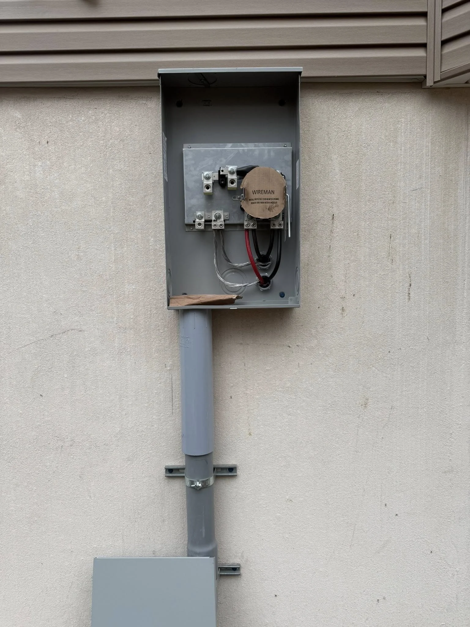 Residential electrical meter base and service equipment installed by an insured NEPA electrician.