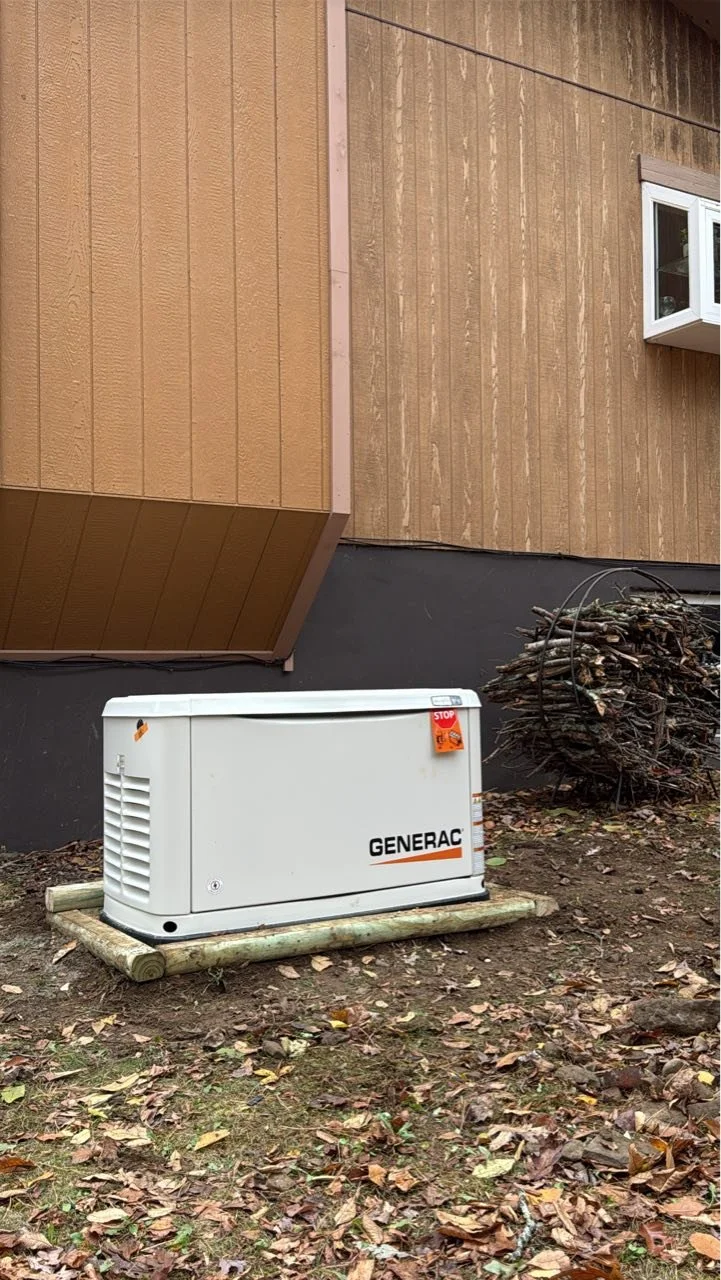 Generac standby generator installed outside a residential home by a NEPA electrical contractor for backup power.