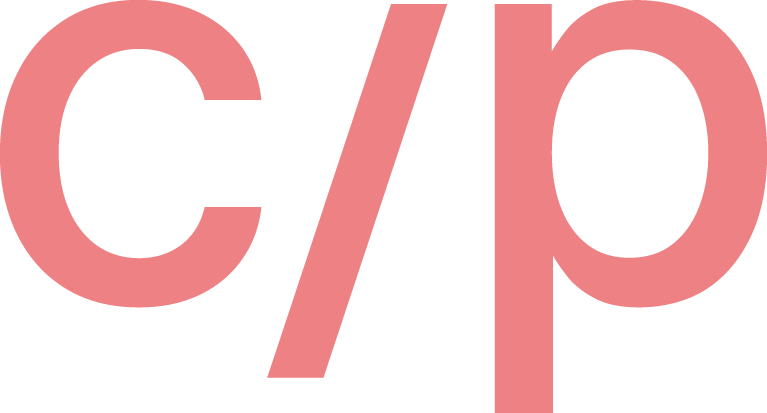 Close-up of the letters "c/p" in pink font on a black background.