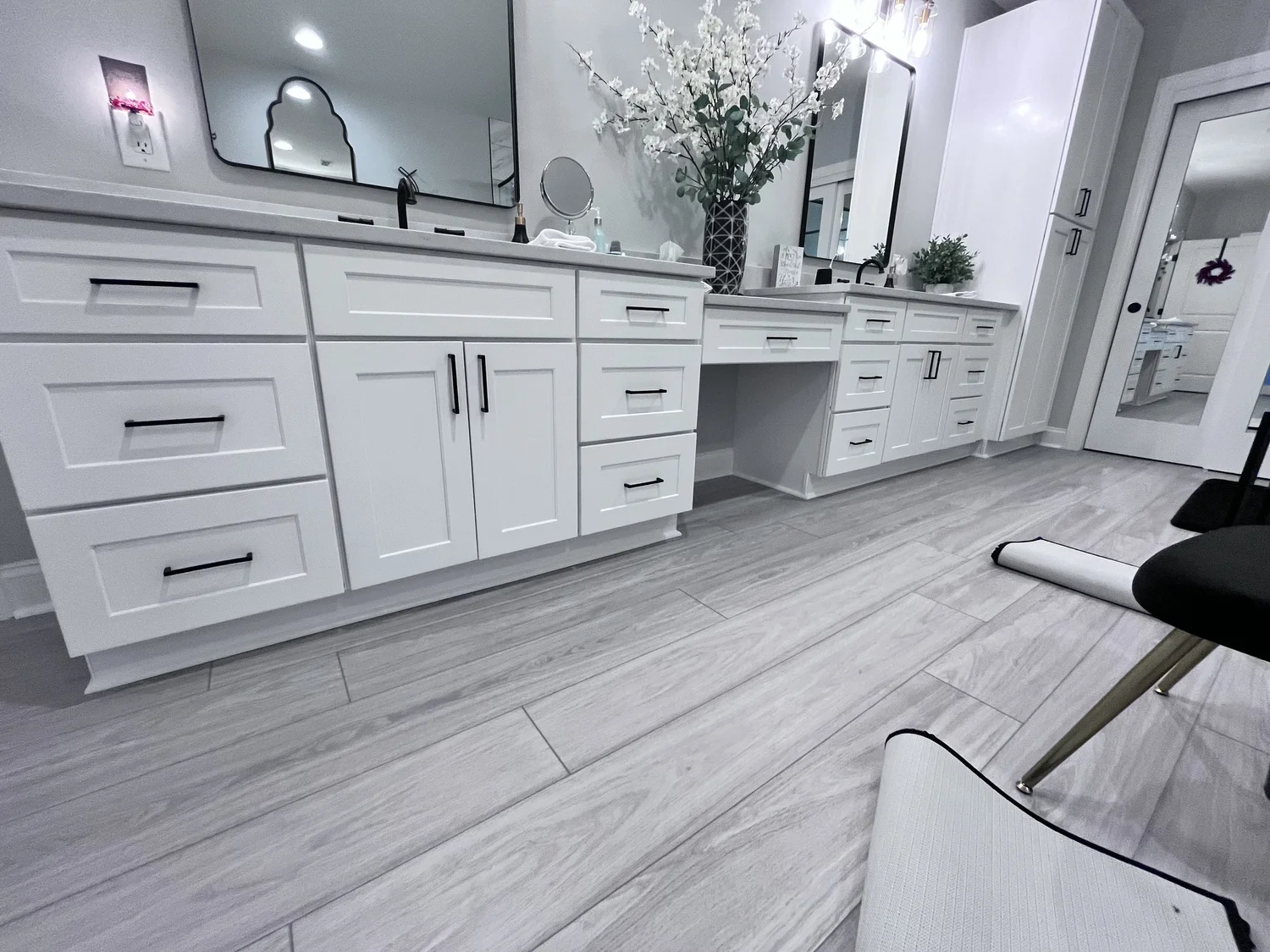 White bathroom cabinetry with black hardware