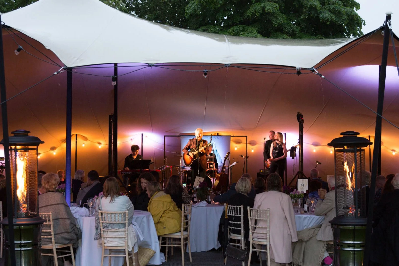 Icon of a disco ball with a handle on top and lines indicating shimmer or lights.