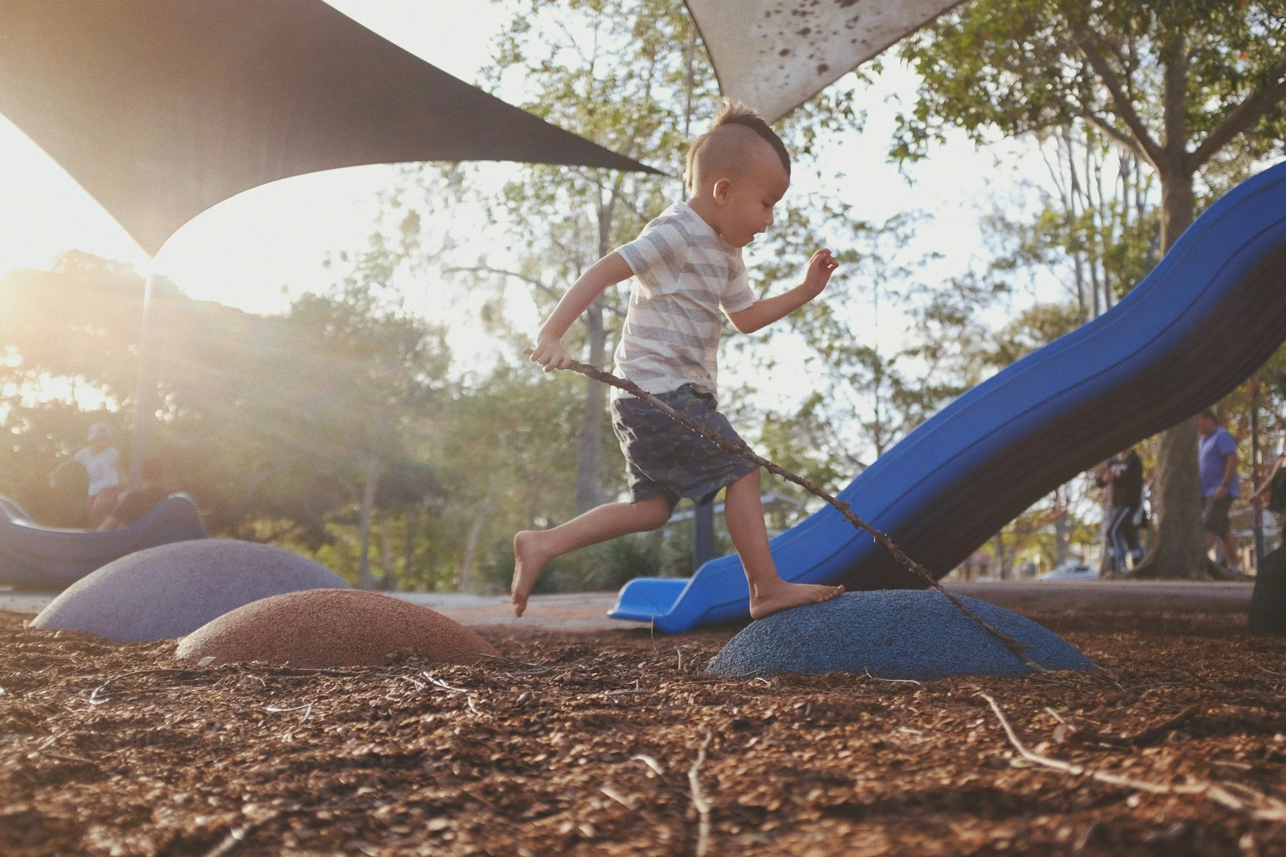Child at Play on Outdoor Playground