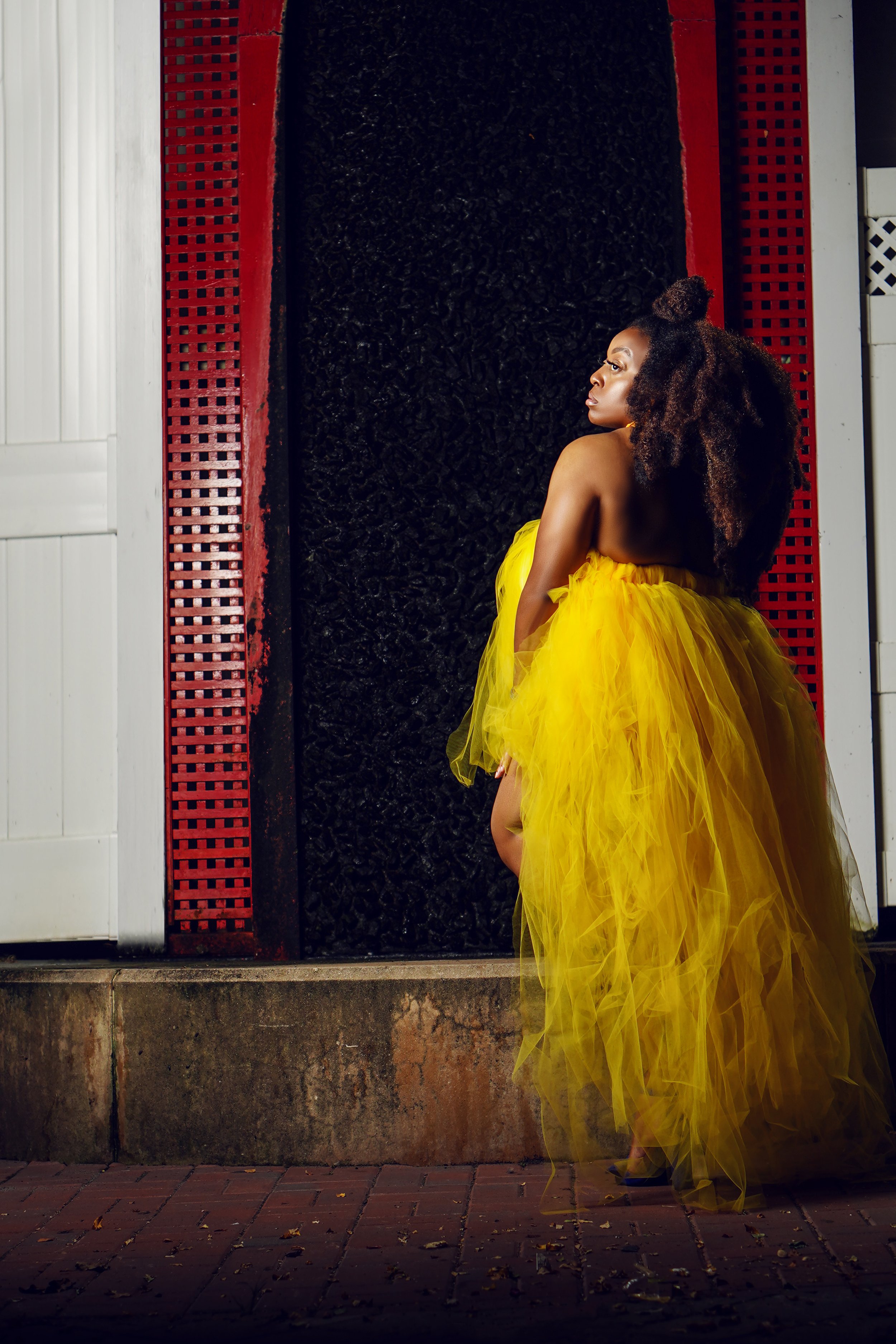 Licensed esthetician and makeup artist in luxury skincare studio specializing in holistic treatments for melanated skin