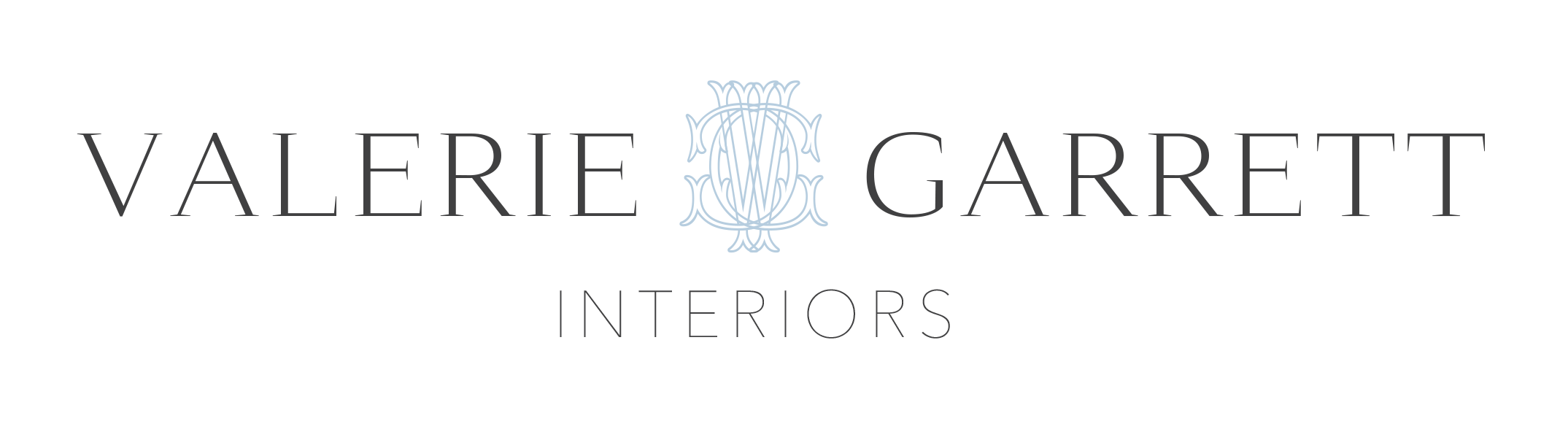 Valerie Garret Interiors logo with black background, displaying stylized text and an intricate monogram emblem in the center.