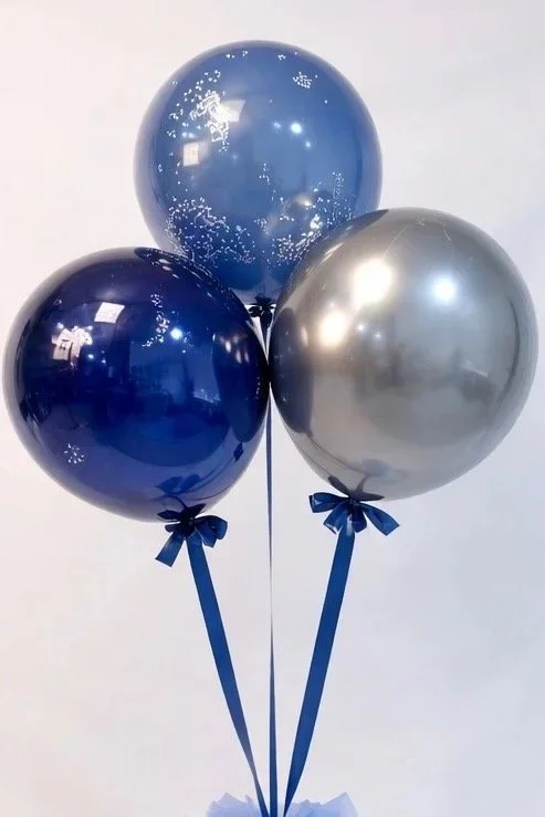 A_digital_photograph_showcases_three_helium-filled.jpg