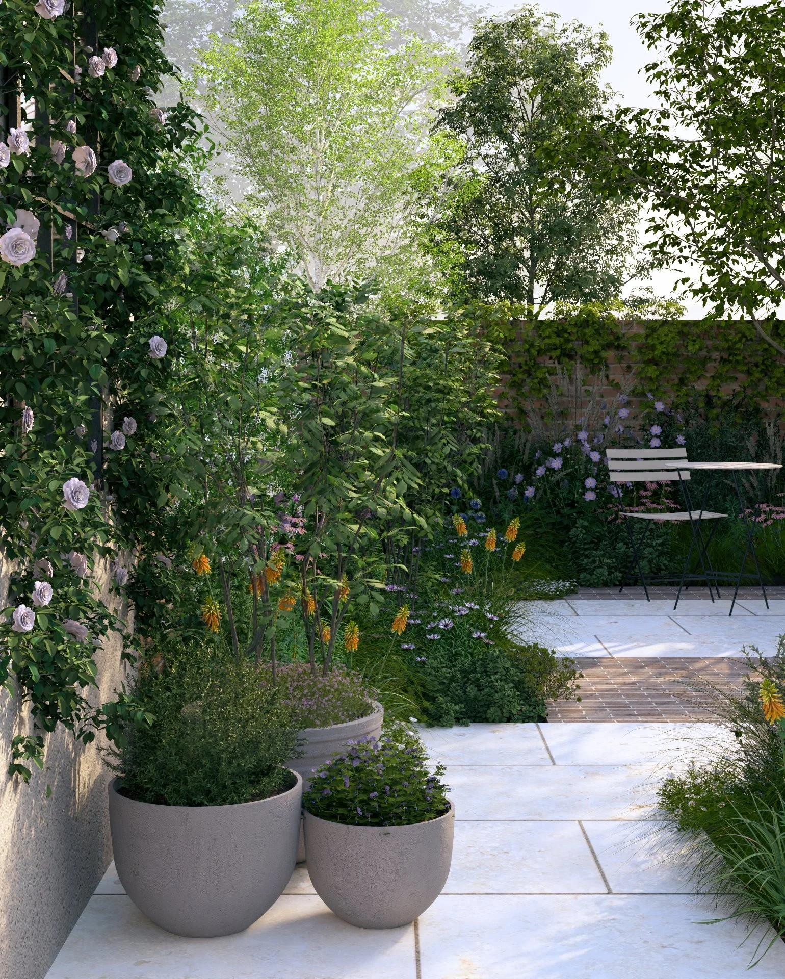 A cozy garden patio with potted plants, flowering bushes, and a small seating area with a bench and table. There are trees and greenery in the background under bright, natural sunlight.