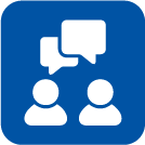 Icon of two people with speech bubbles indicating communication or conversation