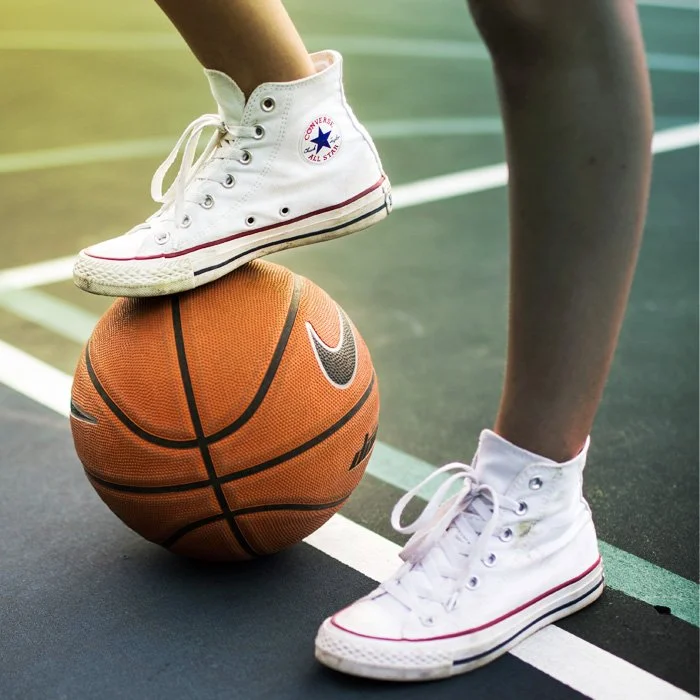 Converse shoe on a basketball