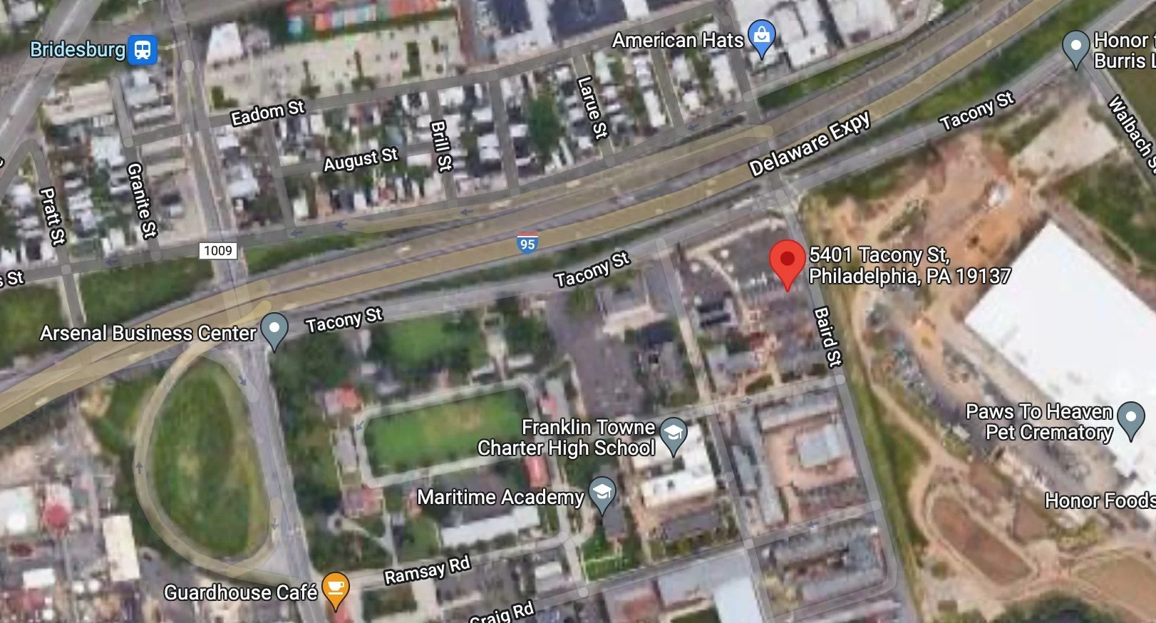 Satellite map showing Tacony Street, Baird Street, and surrounding roads in Philadelphia, PA. Landmarks include Franklin Towne Charter High School, Arsenal Business Center, Guardhouse Cafe, and Paws to Heaven Pet Crematory.